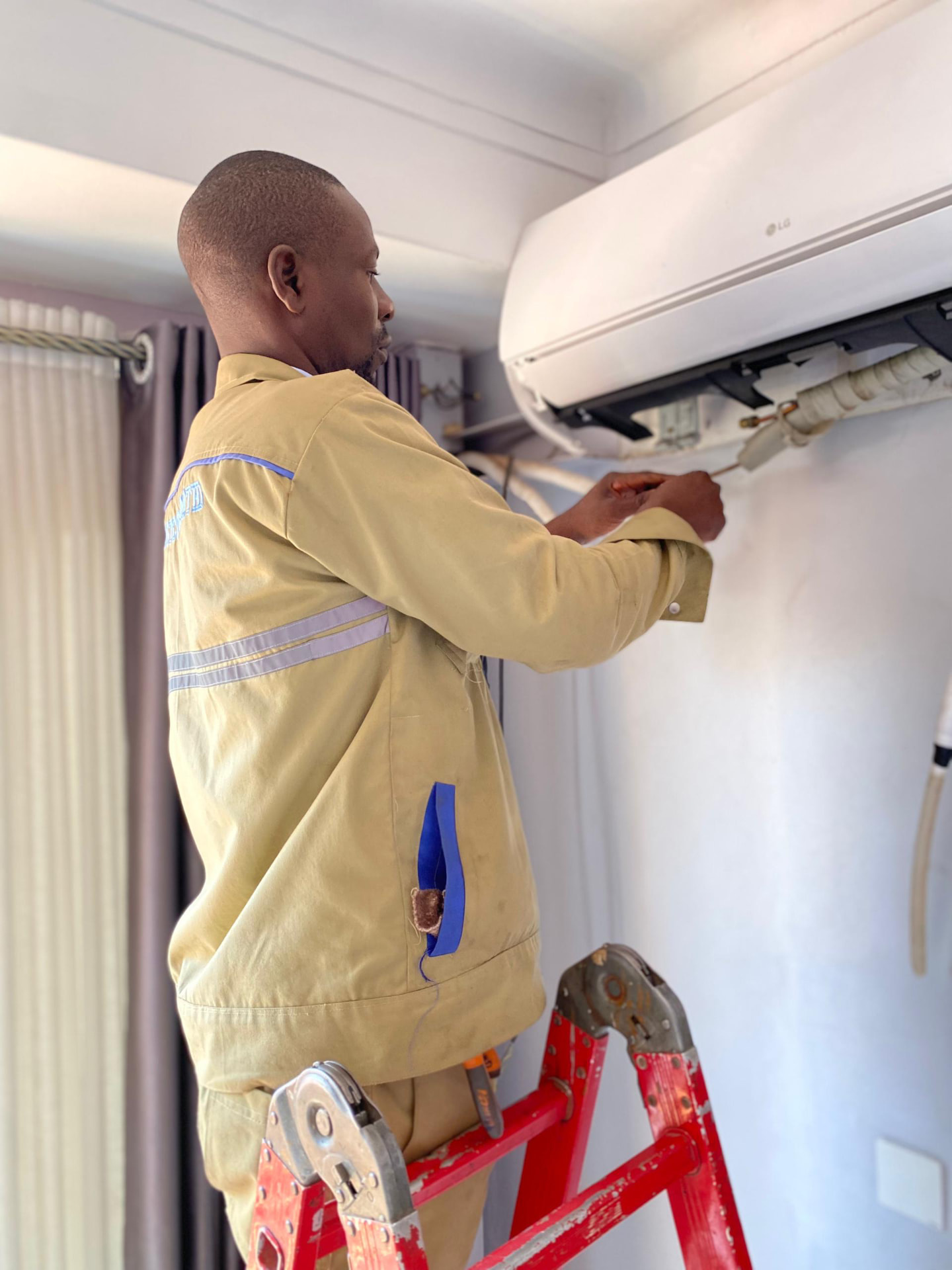 Technician working on an indoor split unit